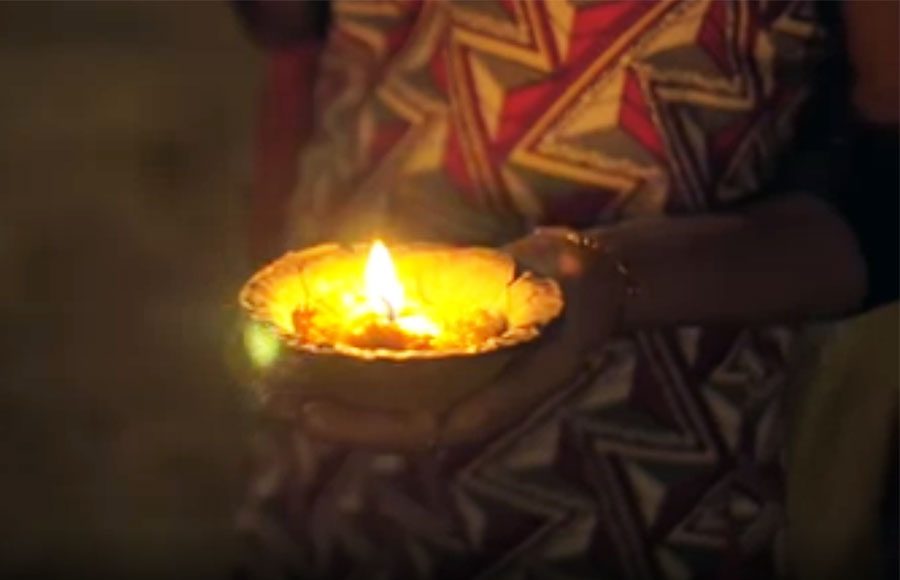 woman-holding-diya